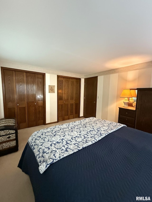 131 E Willard St, Wataga, IL 61488 - bedroom featuring two closets and carpet floors