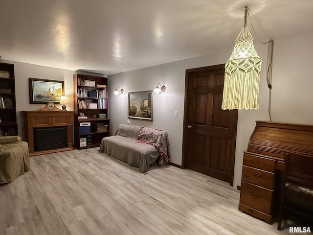 131 E Willard St, Wataga, IL 61488 - bedroom featuring light wood finished floors and a fireplace