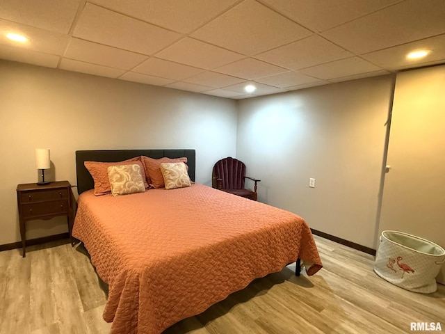 131 E Willard St, Wataga, IL 61488 - bedroom featuring light wood finished floors, baseboards, recessed lighting, and a paneled ceiling