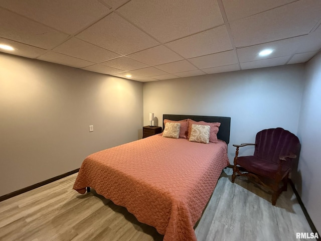 131 E Willard St, Wataga, IL 61488 - bedroom featuring wood finished floors, a paneled ceiling, baseboards, and recessed lighting