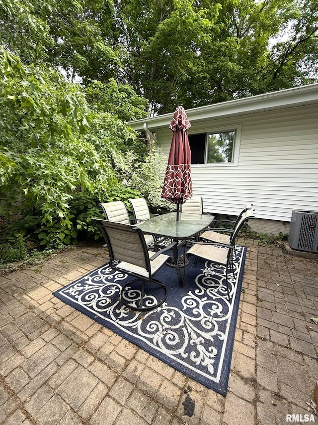 131 E Willard St, Wataga, IL 61488 - view of patio / terrace with outdoor dining area and central AC