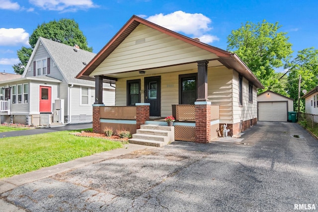 2352 E Converse Ave, Springfield, IL 62702 - view of front of home with covered porch, a garage, and an outdoor structure