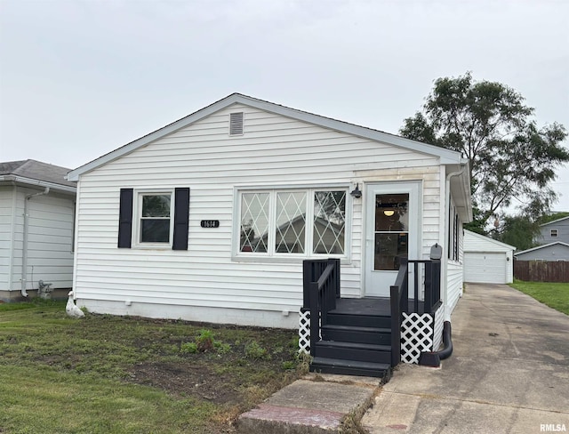 1614 E Converse Ave, Springfield, IL 62702 - view of front of house with a detached garage and an outdoor structure