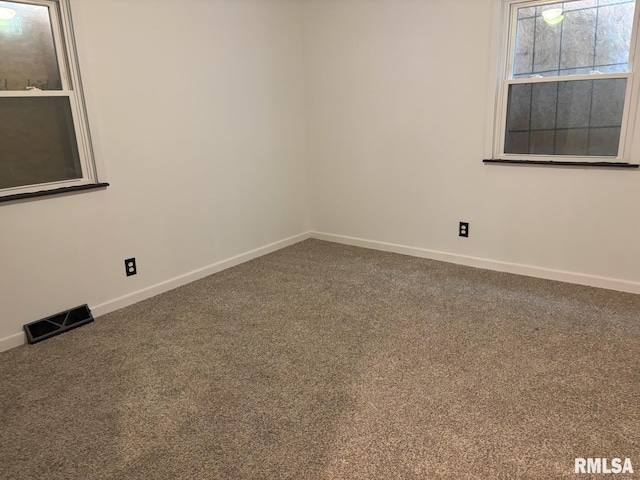 1614 E Converse Ave, Springfield, IL 62702 - carpeted empty room with baseboards
