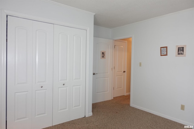 255 S Soangetaha Rd, Galesburg, IL 61401 - bedroom with carpet flooring, crown molding, a closet, and baseboards