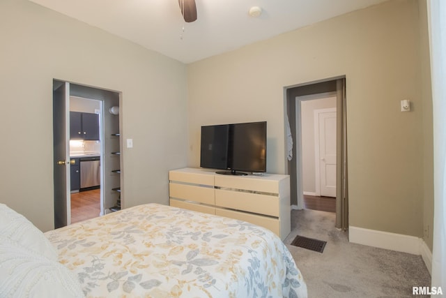 306 N Jefferson St, Abingdon, IL 61410 - bedroom featuring baseboards, light colored carpet, and a ceiling fan