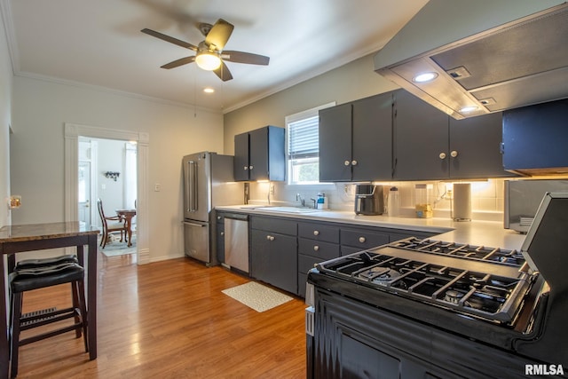 306 N Jefferson St, Abingdon, IL 61410 - kitchen featuring appliances with stainless steel finishes, range hood, a sink, ceiling fan, and ornamental molding