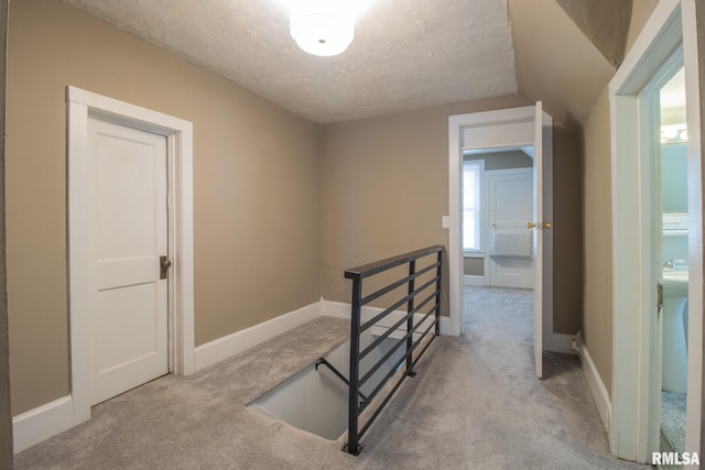 306 N Jefferson St, Abingdon, IL 61410 - stairway with carpet flooring, a textured ceiling, baseboards, and lofted ceiling