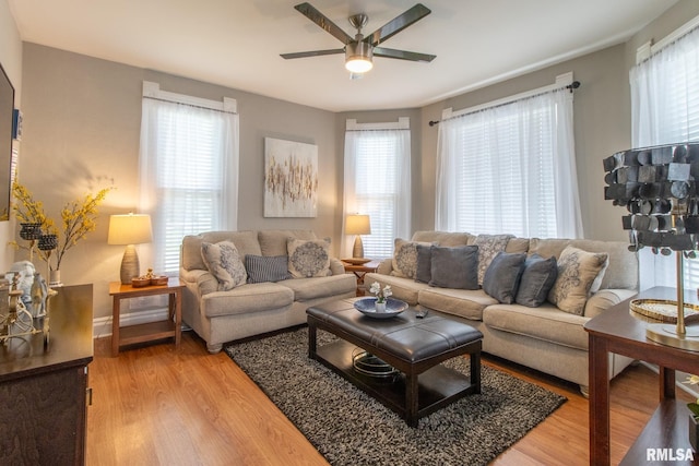 306 N Jefferson St, Abingdon, IL 61410 - living area featuring ceiling fan, light wood finished floors, and healthy amount of natural light