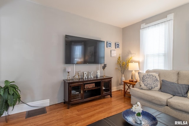 306 N Jefferson St, Abingdon, IL 61410 - living room with light wood-style flooring and baseboards
