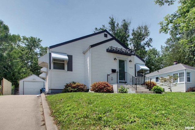 2016 Sycamore St, Quincy, IL 62301 - view of front of home with an outbuilding, a front lawn, a garage, and driveway