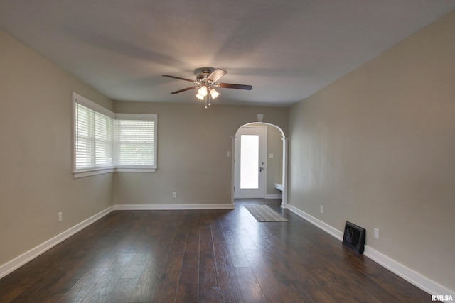 2016 Sycamore St, Quincy, IL 62301 - foyer with arched walkways, a ceiling fan, dark wood-style flooring, and baseboards