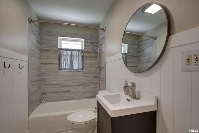 2016 Sycamore St, Quincy, IL 62301 - full bath featuring shower / bath combination, vanity, toilet, and a wainscoted wall