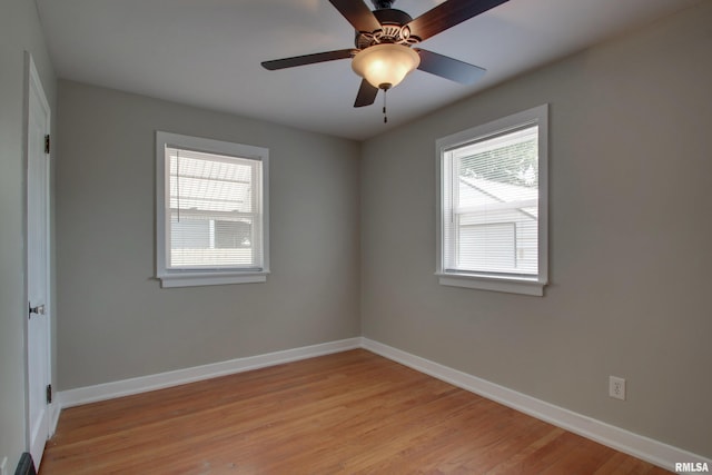 2016 Sycamore St, Quincy, IL 62301 - spare room featuring plenty of natural light, baseboards, light wood-type flooring, and ceiling fan