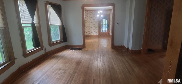 1262 N Broad St, Galesburg, IL 61401 - unfurnished room featuring wood finished floors, baseboards, and wallpapered walls