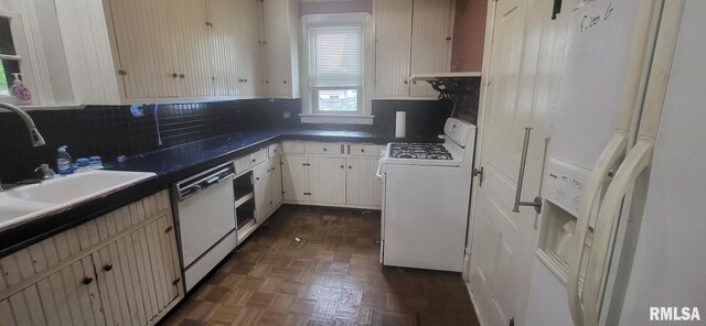 1262 N Broad St, Galesburg, IL 61401 - kitchen with white appliances, decorative backsplash, dark countertops, and a sink