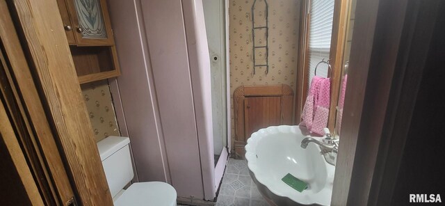 1262 N Broad St, Galesburg, IL 61401 - bathroom featuring wallpapered walls, a sink, toilet, and tile patterned flooring