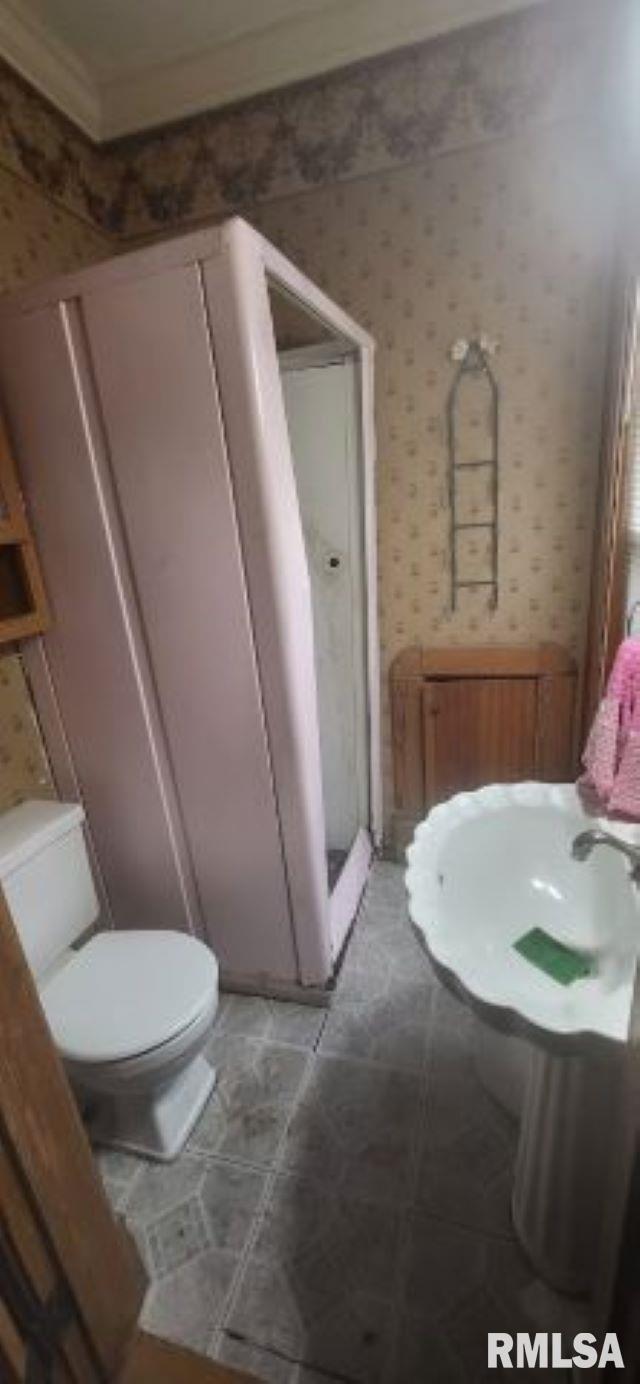 1262 N Broad St, Galesburg, IL 61401 - bathroom with toilet, wallpapered walls, and ornamental molding
