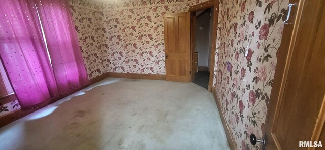 1262 N Broad St, Galesburg, IL 61401 - spare room featuring wallpapered walls