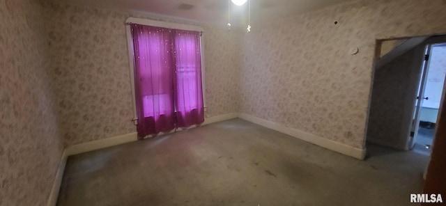 1262 N Broad St, Galesburg, IL 61401 - carpeted spare room featuring baseboards and wallpapered walls
