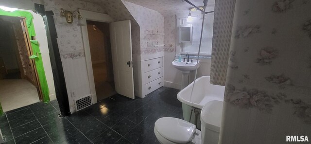 1262 N Broad St, Galesburg, IL 61401 - bathroom with wallpapered walls, toilet, and tile patterned floors