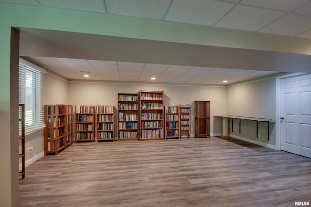 507 W Fairway Dr, Quincy, IL 62305 - sitting room featuring wood finished floors, a paneled ceiling, baseboards, bookshelves, and recessed lighting