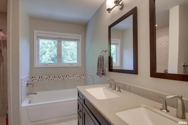 507 W Fairway Dr, Quincy, IL 62305 - bathroom featuring a garden tub and double vanity