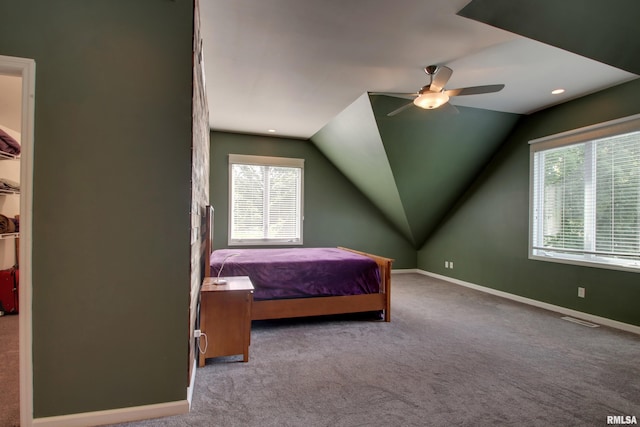 507 W Fairway Dr, Quincy, IL 62305 - carpeted bedroom featuring multiple windows, lofted ceiling, baseboards, and a ceiling fan