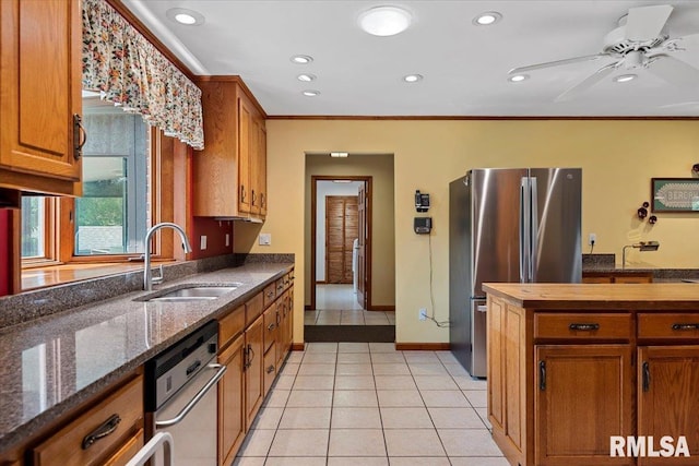 7 Marshall Ct, Springfield, IL 62563 - kitchen with freestanding refrigerator, a sink, a ceiling fan, ornamental molding, and brown cabinetry