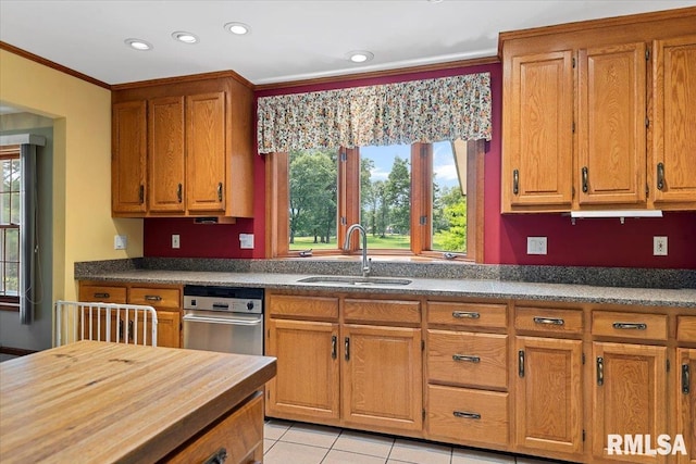 7 Marshall Ct, Springfield, IL 62563 - kitchen with a sink, brown cabinets, recessed lighting, crown molding, and light tile patterned flooring