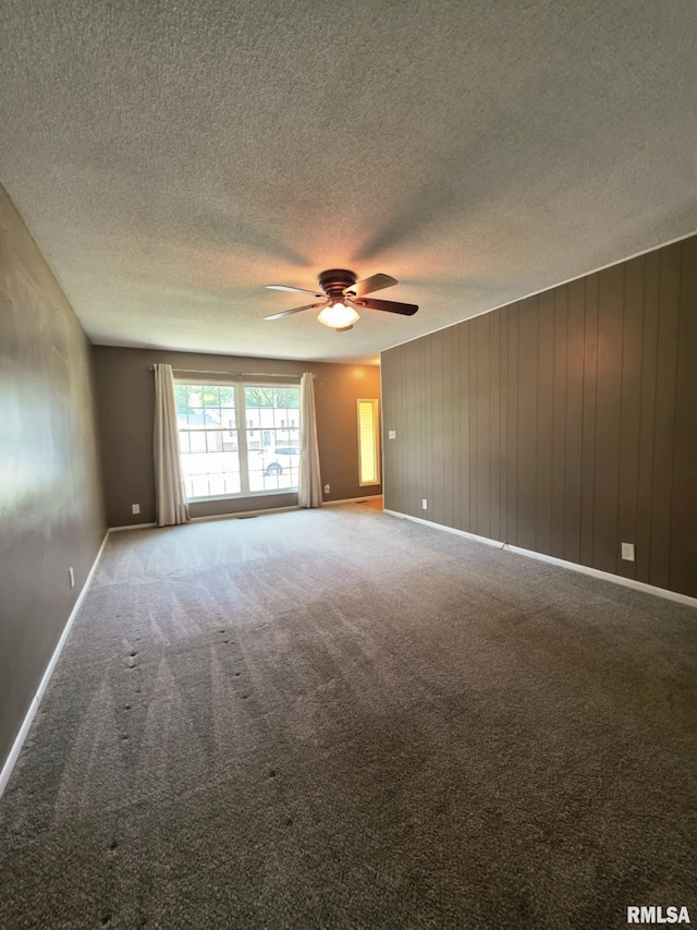 1246 Curtis Creek Rd, Quincy, IL 62301 - carpeted empty room with ceiling fan, a textured ceiling, and baseboards