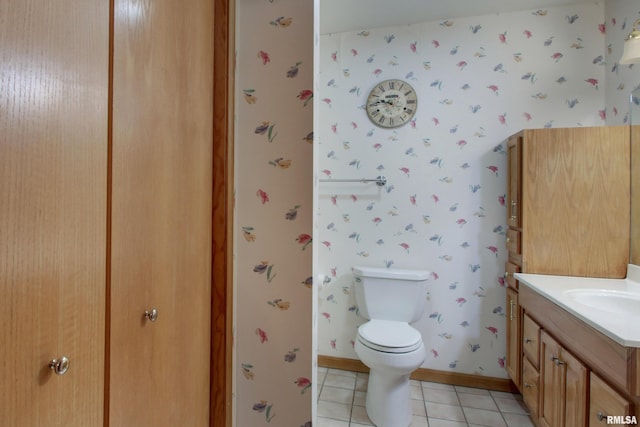 2044 N 1200th Ave, Liberty, IL 62347 - bathroom featuring vanity, wallpapered walls, toilet, tile patterned flooring, and baseboards