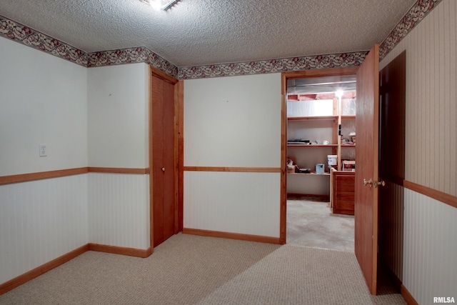 2044 N 1200th Ave, Liberty, IL 62347 - spare room with a textured ceiling, carpet floors, and baseboards
