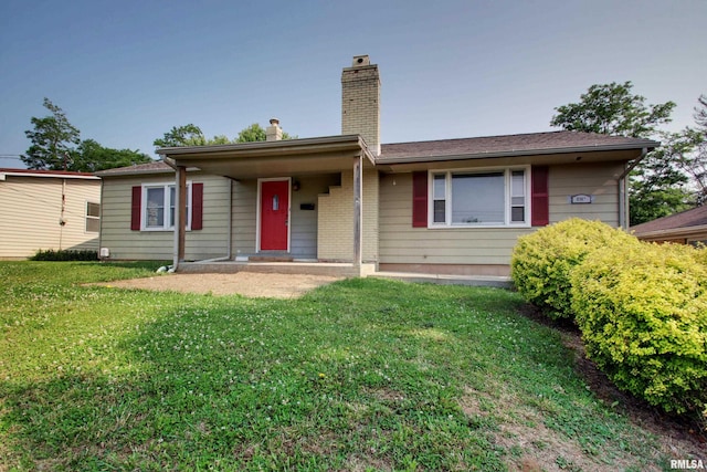 2317 Harrison St, Quincy, IL 62301 - ranch-style house with a chimney and a front yard