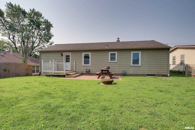 2317 Harrison St, Quincy, IL 62301 - back of property with a wooden deck and a patio area