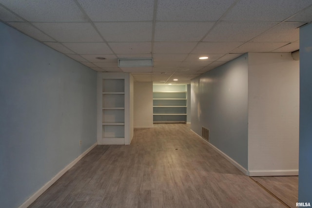 2317 Harrison St, Quincy, IL 62301 - hall featuring wood finished floors, baseboards, a drop ceiling, built in shelves, and recessed lighting