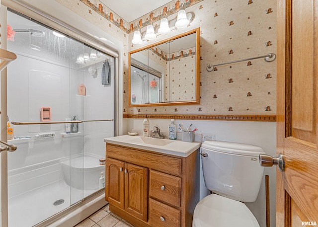 1354 Airport Rd, Lincoln, IL 62656 - bathroom featuring wallpapered walls, toilet, vanity, a stall shower, and tile patterned floors