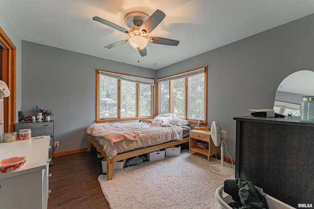 1354 Airport Rd, Lincoln, IL 62656 - bedroom with baseboards, wood finished floors, and a ceiling fan