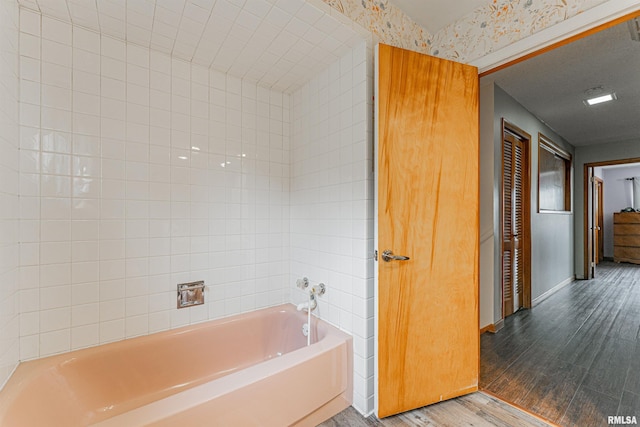 1354 Airport Rd, Lincoln, IL 62656 - full bathroom with wood finished floors, a garden tub, and baseboards