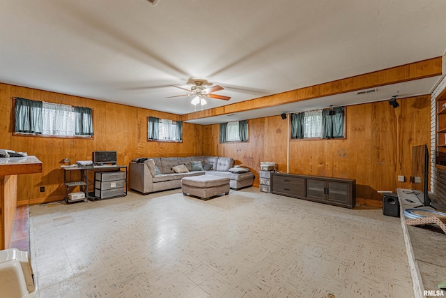 1354 Airport Rd, Lincoln, IL 62656 - living room featuring wooden walls and ceiling fan