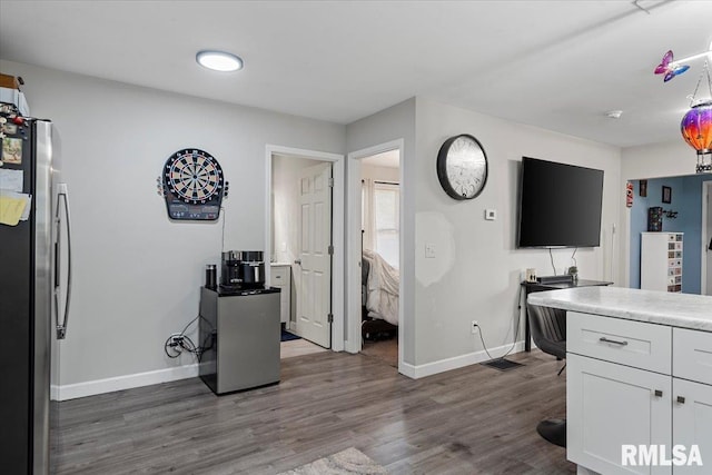 2705 S Walnut St, Springfield, IL 62704 - kitchen with freestanding refrigerator, baseboards, white cabinetry, and dark wood-style floors