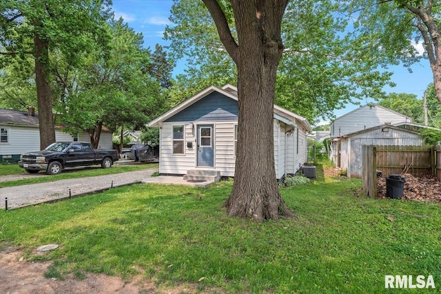 2705 S Walnut St, Springfield, IL 62704 - view of front of house with entry steps, central AC unit, and gravel driveway