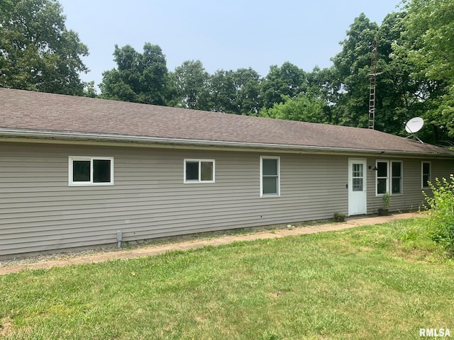27425 Quarton Rd, Palmyra, IL 62674 - rear view of house featuring a lawn