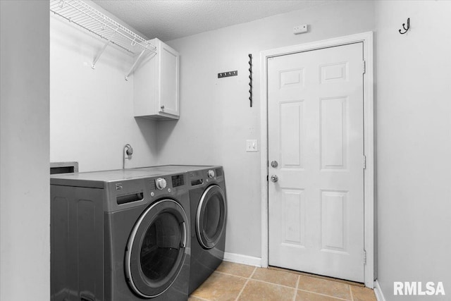 69 Axline Rd, Chatham, IL 62629 - laundry area featuring separate washer and dryer, cabinet space, a textured ceiling, and light tile patterned floors