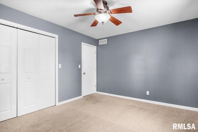 69 Axline Rd, Chatham, IL 62629 - unfurnished bedroom with carpet flooring, a closet, and a ceiling fan
