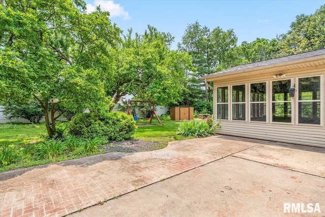 69 Axline Rd, Chatham, IL 62629 - view of patio / terrace featuring a shed and a playground