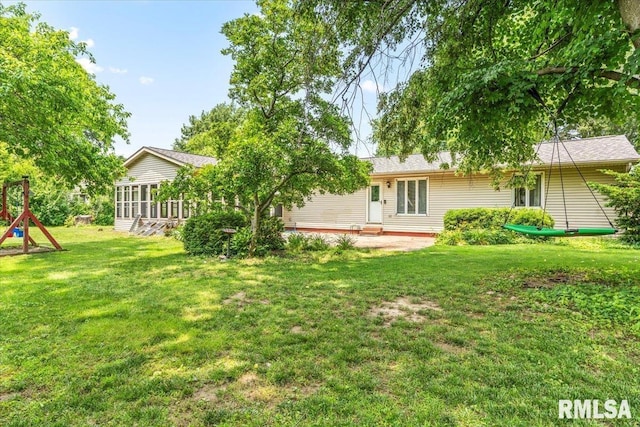 69 Axline Rd, Chatham, IL 62629 - view of grassy yard with a sunroom and a patio