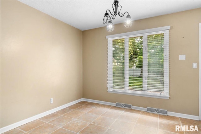 69 Axline Rd, Chatham, IL 62629 - unfurnished room with a chandelier and light tile patterned floors