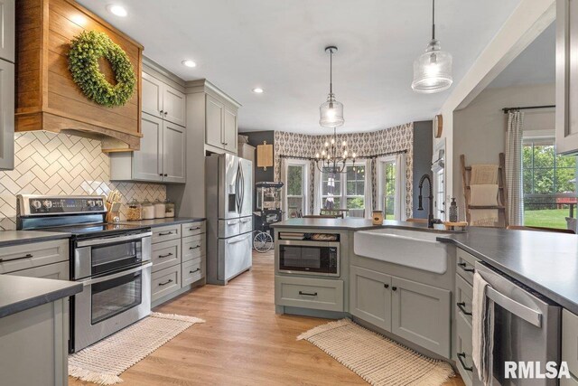 33 Vista Rdg, Petersburg, IL 62675 - kitchen with appliances with stainless steel finishes, a sink, dark countertops, gray cabinets, and a chandelier