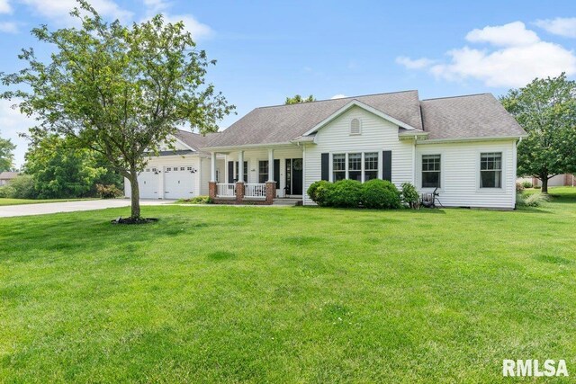 33 Vista Rdg, Petersburg, IL 62675 - view of front of house with a porch, driveway, an attached garage, and a front lawn